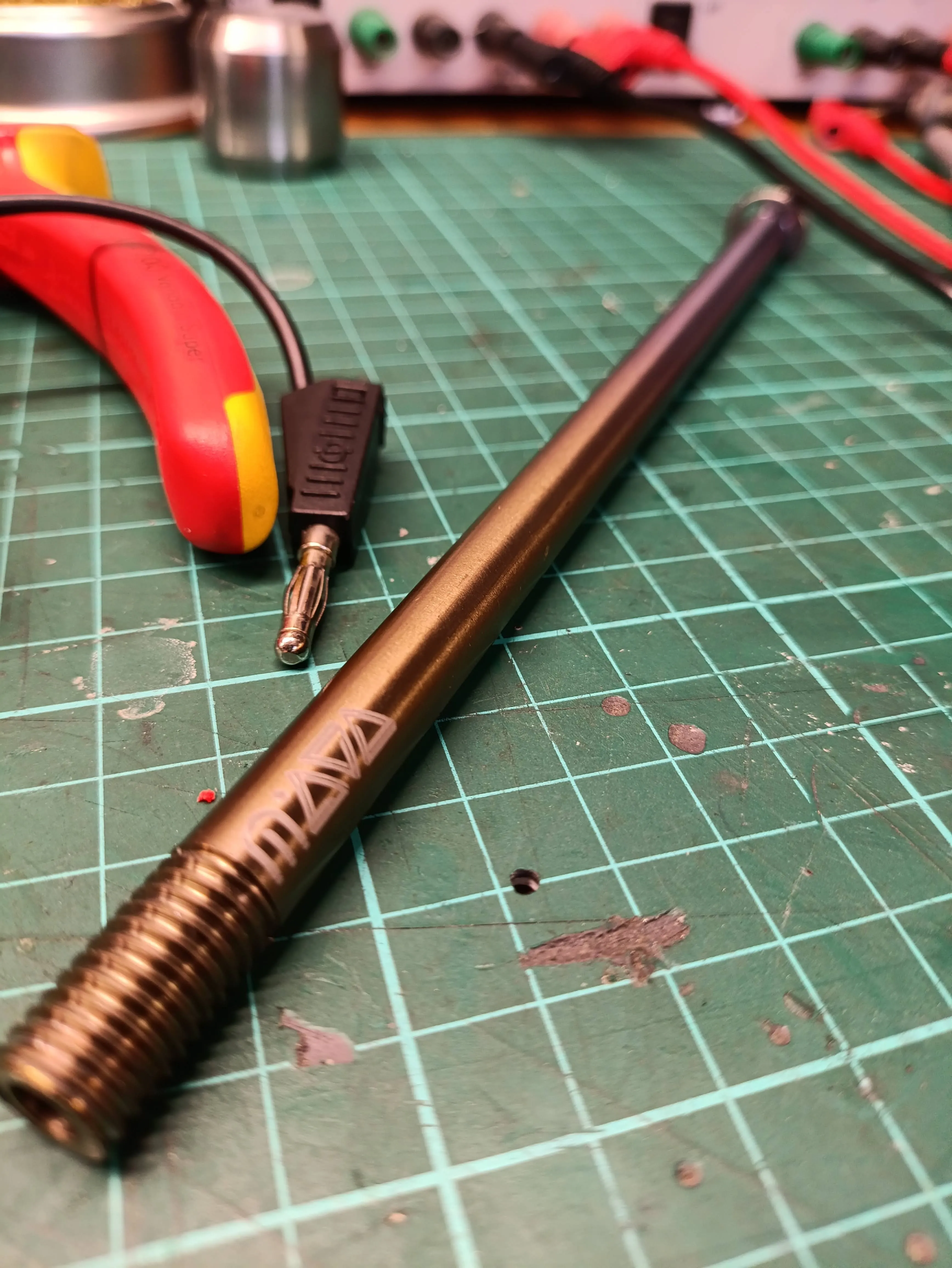 Anodized titanium rod with laser marking and machined threads