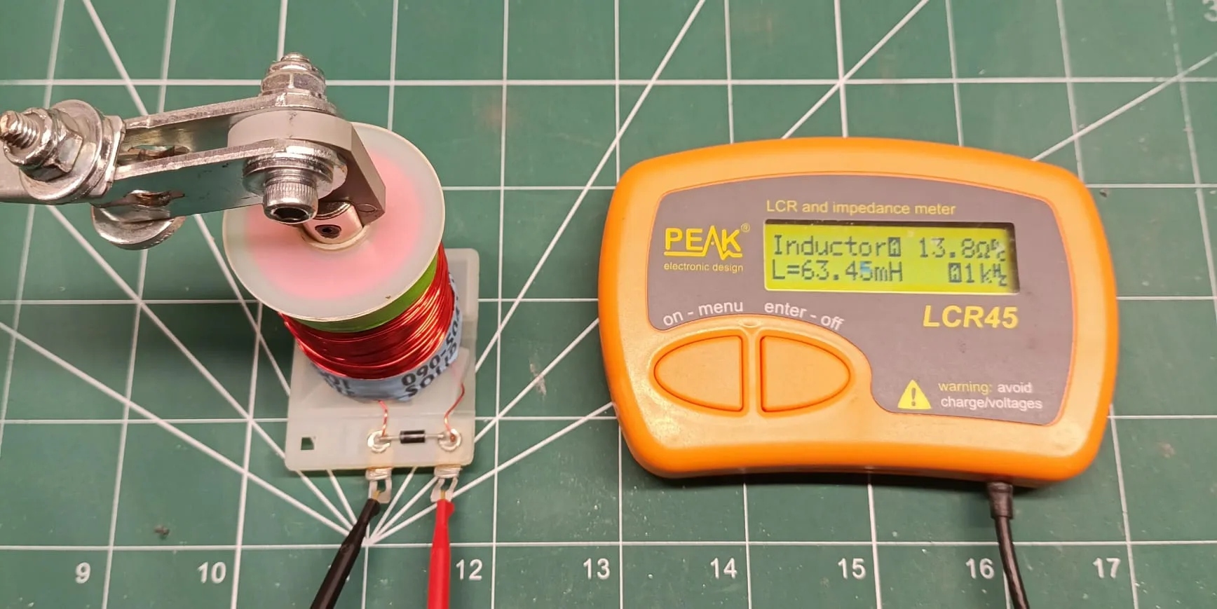 LCR meter reading 63.45 mH for the same flipper coil with the plunger fully inserted.