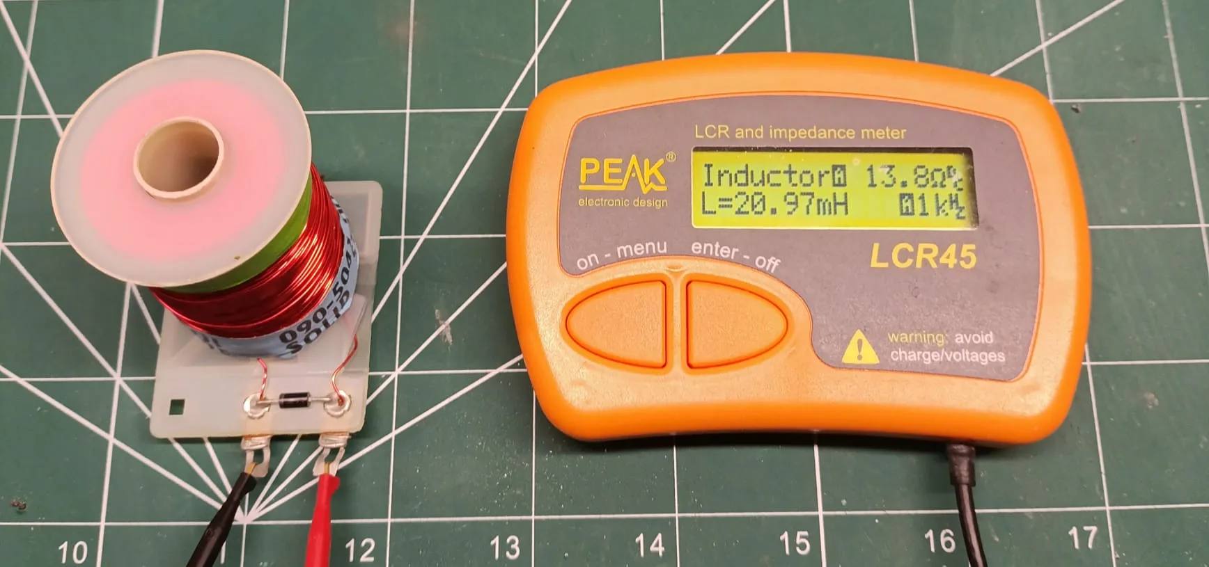 LCR meter reading 20.97 mH for a flipper coil with the plunger fully withdrawn.